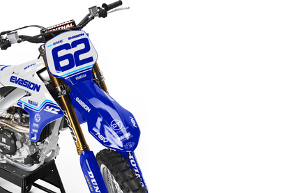 White yamaha dirt bike with white plastics and blue, cyan, and white design side view