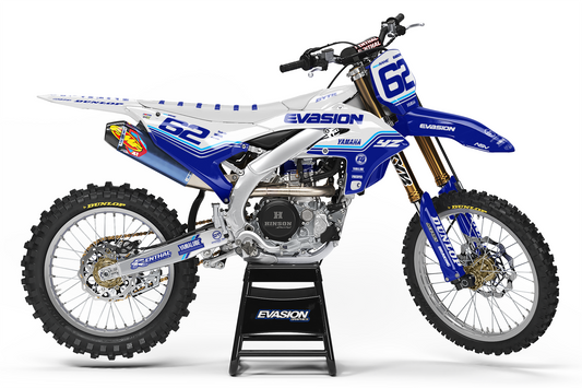 White yamaha dirt bike with white plastics and blue, cyan, and white design side view